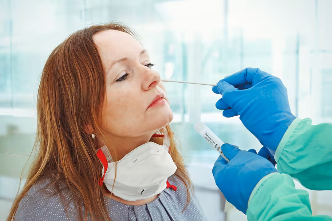 Medic taking sample from patients nose for coronavirus testing