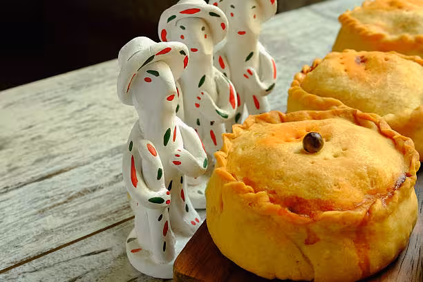 Typical mallorcan pork and peas pies with Siurell (traditional clay figure in Majorca)