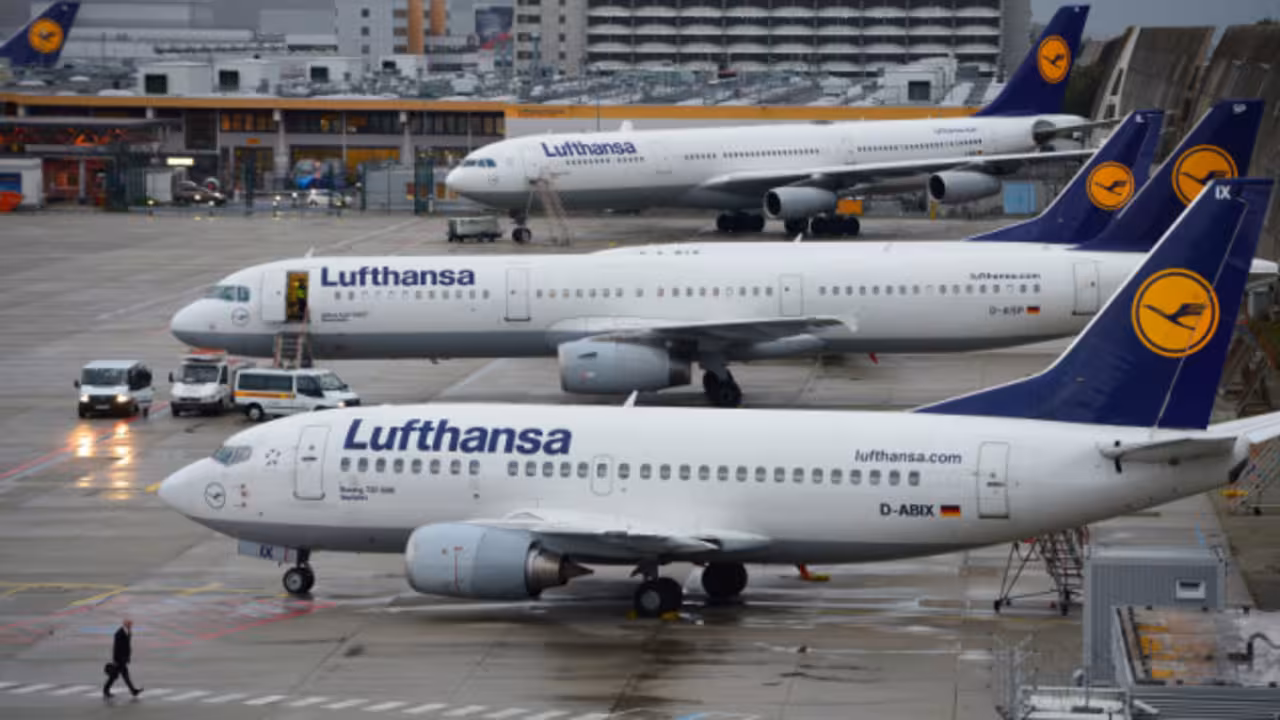 FRANKFURT AM MAIN, GERMANY - OCTOBER 21:  A man walkes in front of Lufthansa airplanes at the Frankfurt Airport on October 21, 2014 in Frankfurt am Main, Germany. Vereinigung Cockpit, the labor union that represents the pilots, launched the two-day strike yesterday that has been expanded from short and medium-distance flights on the first day to long haul flights today, affecting over 100,000 passengers. This is the seventh strike by Lufthansa and Germanwings (a Lufthansa subsidiary) pilots this year as the union attempts to maintain the Lufthansa pilots' early retirement guarantee, a benefit that Lufthansa is trying to cut.  (Photo by Thomas Lohnes/Getty Images)
