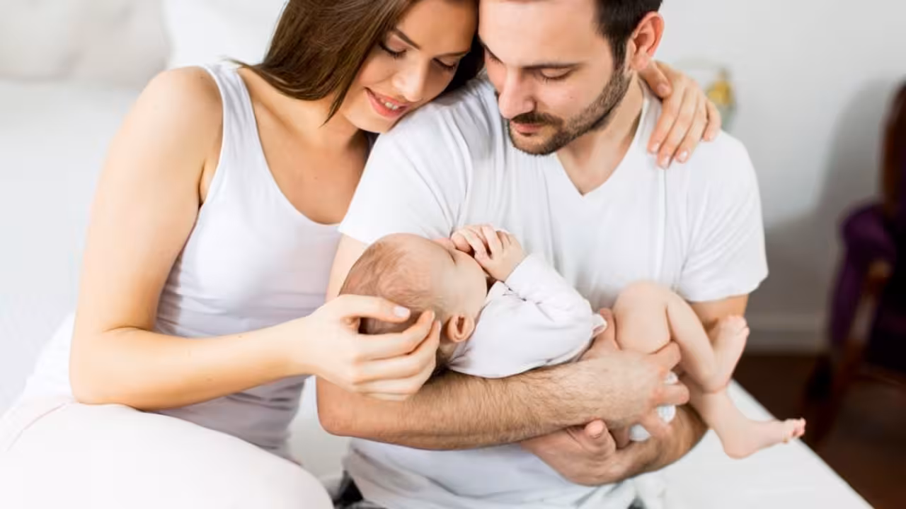 Happy family with newborn baby