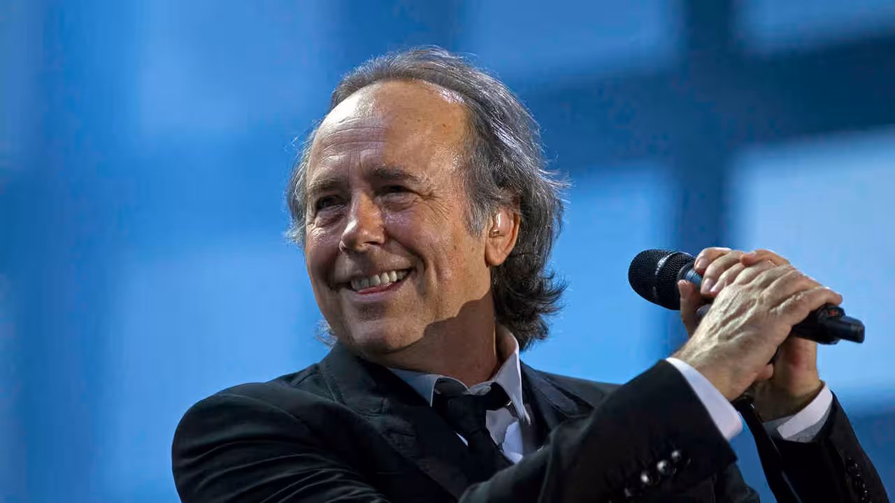 FILE - In this March 17, 2012 file photo, Joan Manuel Serrat smiles while performing with fellow artist, Joaquin Sabina in their "Dos Pajaros Contraatacan," or "Two Birds Strike Back," tour in Buenos Aires, Argentina. The Spanish singer-songwriter has been named the 2014 Latin Recording Academy Person of the Year announced the Latin Grammy organization Tuesday, Sept. 9, 2014. (AP Photo/Natacha Pisarenko, File)