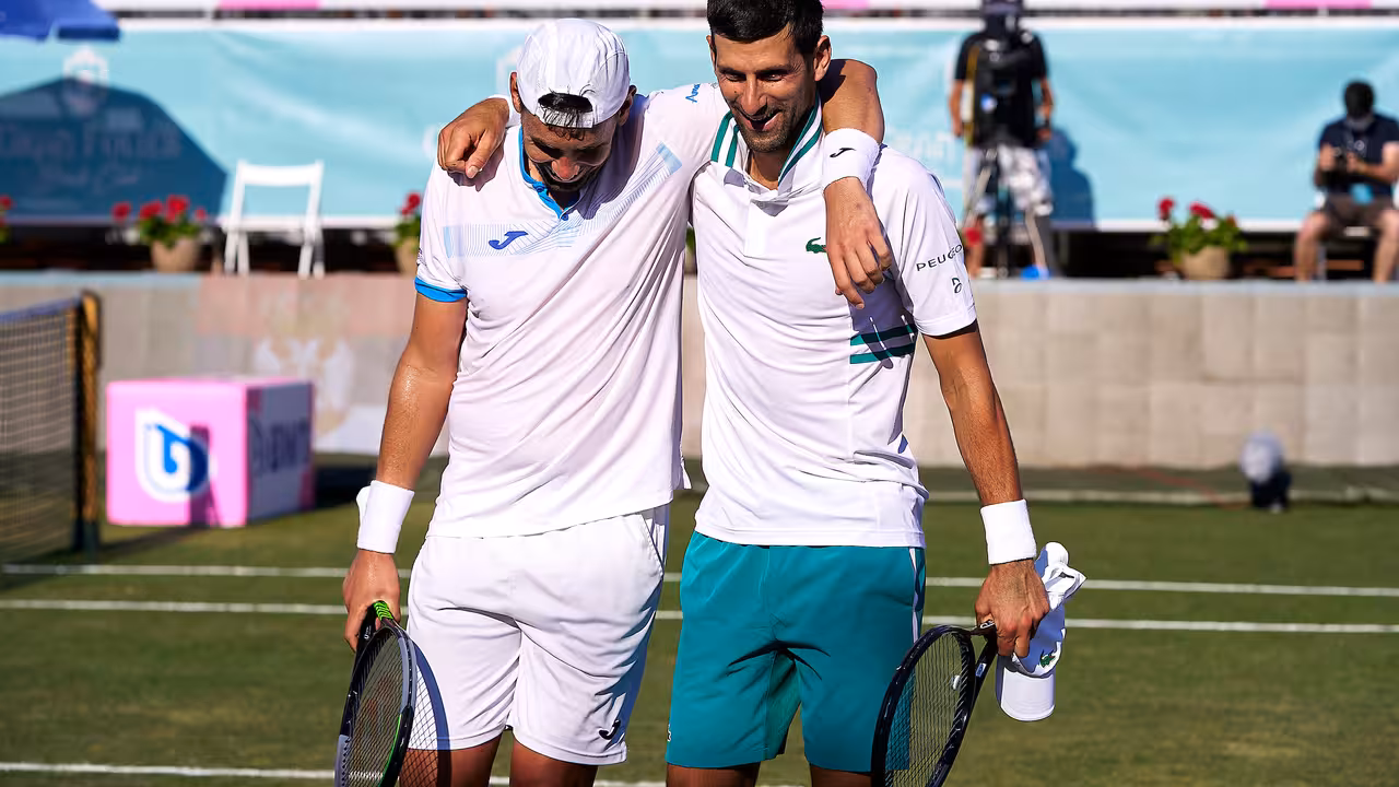 CALVIA, SPAIN - JUNE 22:  Novak Djokovic of Serbia Carlos Gomez-Herrera of Spain ATP Mallorca Championships 2021 at Country Club de Santa Ponça on June 23, 2021 in Calvia, Spain. (Photo by Manuel Queimadelos/Quality Sport Images)